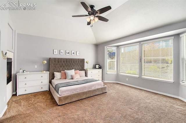 carpeted bedroom featuring ceiling fan and lofted ceiling