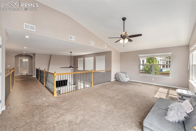 interior space with high vaulted ceiling, ceiling fan, and carpet