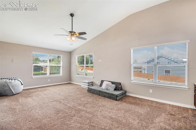 sitting room with carpet flooring, ceiling fan, and high vaulted ceiling