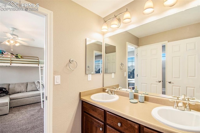 bathroom featuring ceiling fan and vanity