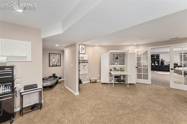 interior space with french doors and light carpet