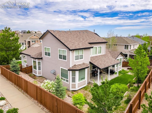 back of property with a patio area