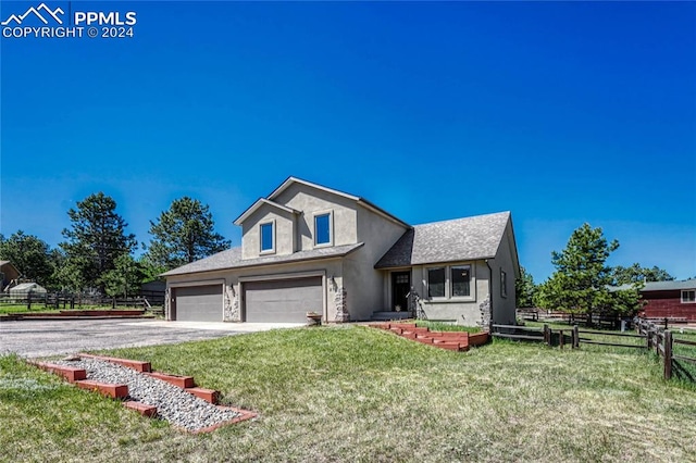 view of front of home featuring a front lawn and a garage