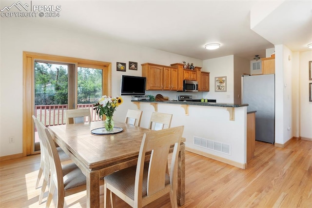 dining area with light hardwood / wood-style flooring