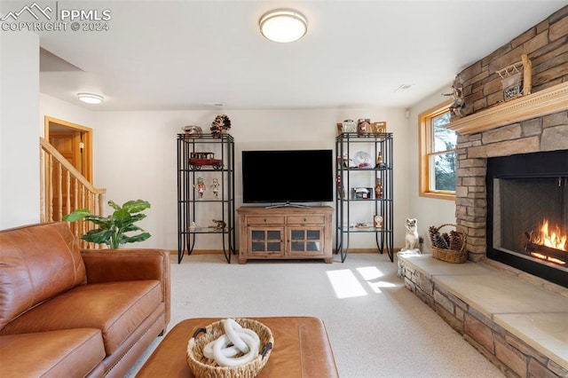 living room with carpet flooring and a fireplace