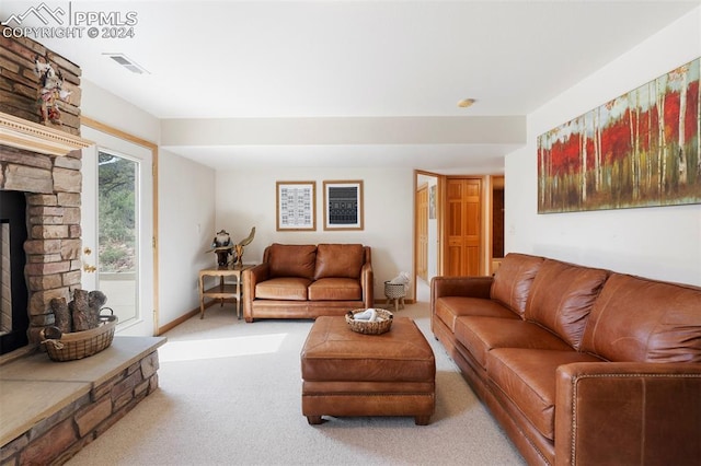 living room featuring a fireplace and carpet flooring