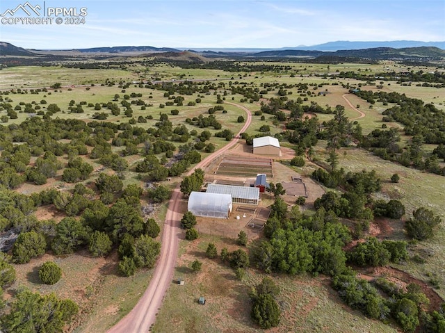 aerial view featuring a rural view and a mountain view