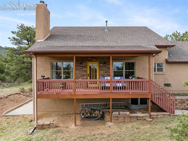 rear view of property with a deck