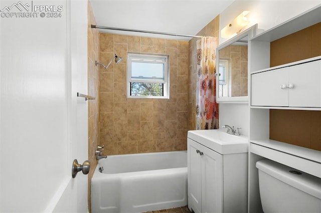 full bathroom with shower / tub combo, toilet, and vanity