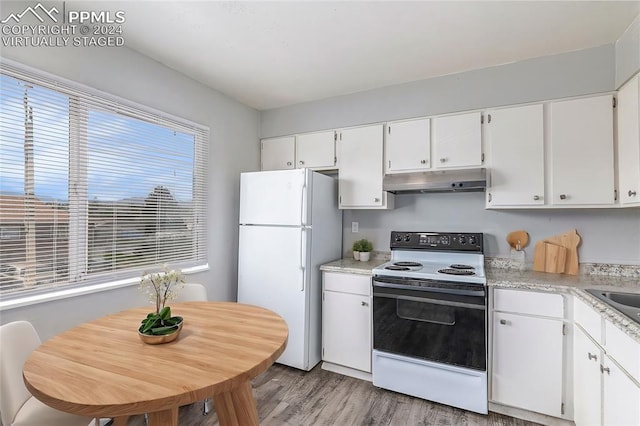 kitchen with white cabinetry, sink, white appliances, and light hardwood / wood-style floors