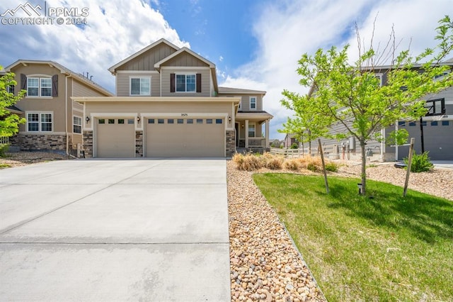 view of front of home with a garage and a front yard