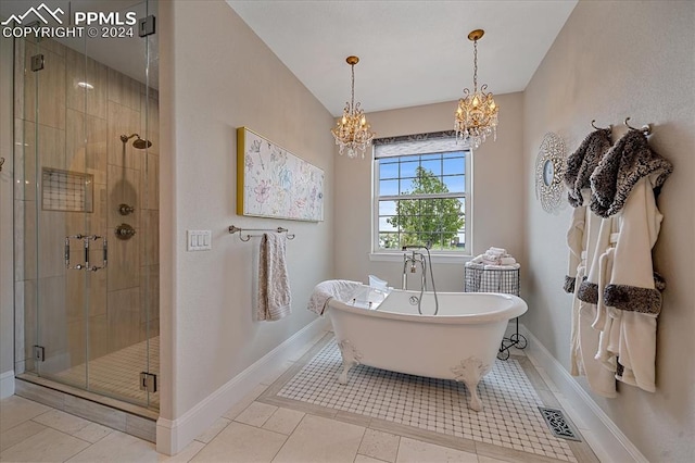 bathroom featuring tile flooring, independent shower and bath, and an inviting chandelier