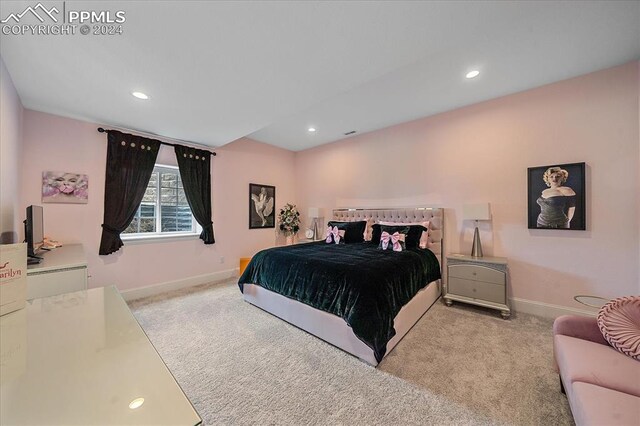 bedroom featuring light carpet