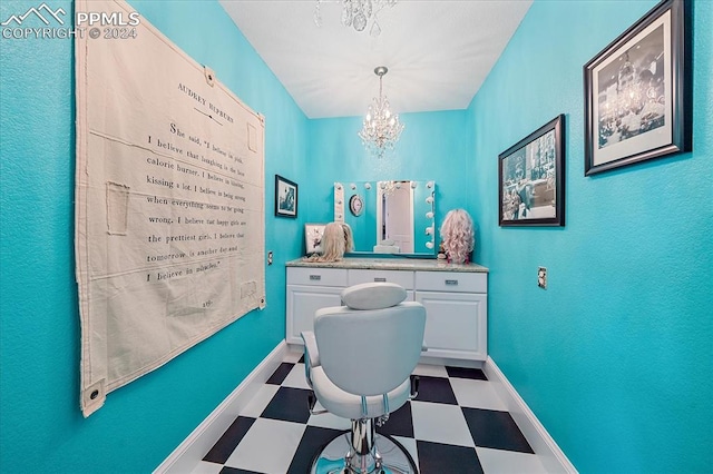 interior space featuring dark tile flooring and an inviting chandelier