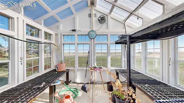 sunroom / solarium with a healthy amount of sunlight and vaulted ceiling