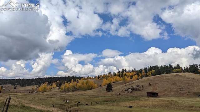 property view of mountains featuring a rural view