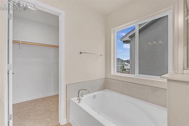 9759 Feathergrass Dr, Colorado Springs, CO 80927 - full bathroom with a bath and a spacious closet