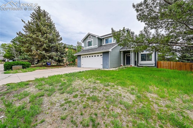 view of front of home with a garage and a front yard