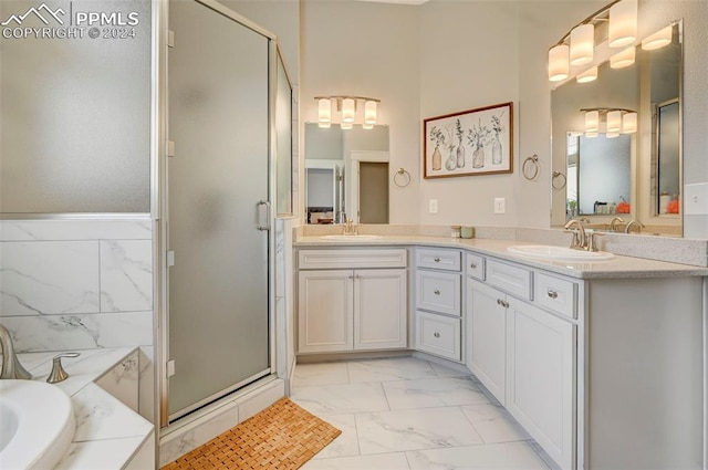 bathroom featuring vanity, independent shower and bath, and tile walls