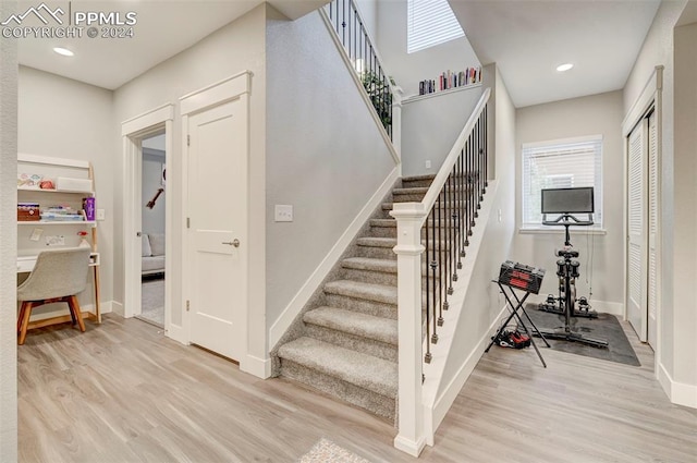 staircase featuring hardwood / wood-style flooring