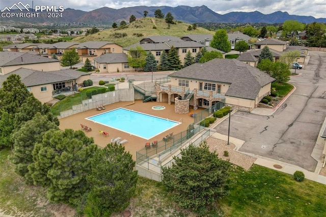 view of swimming pool with a mountain view