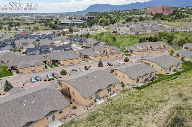 birds eye view of property with a mountain view