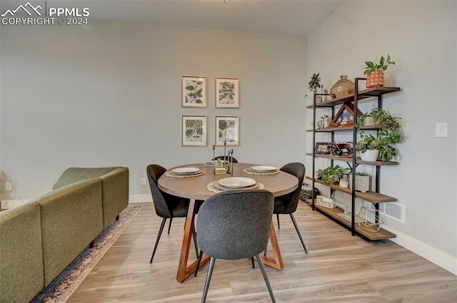 dining room with light wood-type flooring