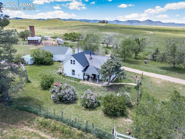 drone / aerial view with a mountain view and a rural view