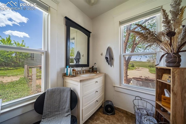 bathroom with vanity and a healthy amount of sunlight