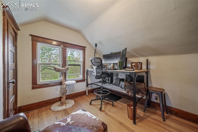 office featuring light hardwood / wood-style floors and vaulted ceiling