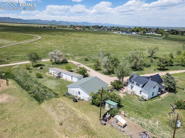 birds eye view of property with a mountain view and a rural view