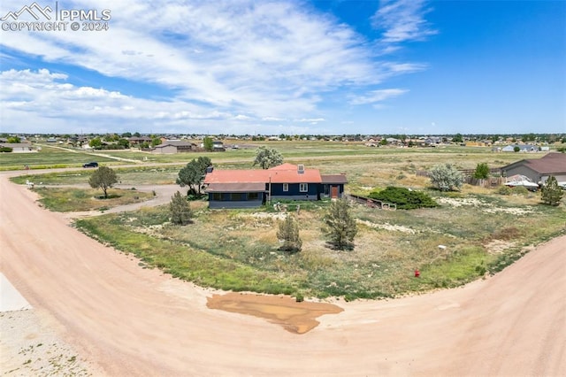 birds eye view of property featuring a rural view