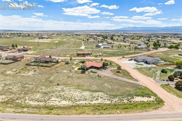 drone / aerial view featuring a mountain view