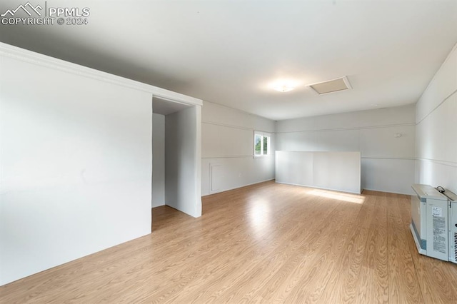 empty room with light hardwood / wood-style flooring