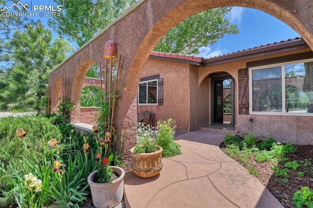 entrance to property with a patio area