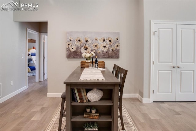 dining space with light hardwood / wood-style flooring