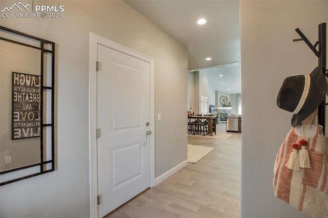 hall with light hardwood / wood-style flooring