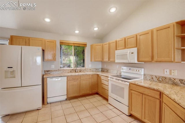 kitchen featuring white appliances, light tile patterned floors, sink, and light brown cabinets