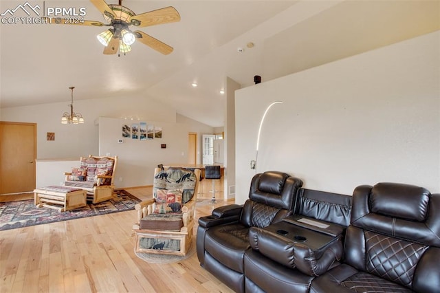 living room with lofted ceiling, ceiling fan, and light hardwood / wood-style flooring