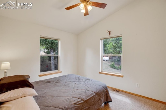 carpeted bedroom featuring lofted ceiling and ceiling fan