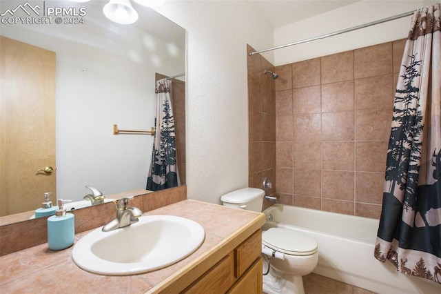 full bathroom featuring vanity, shower / bath combination with curtain, and toilet