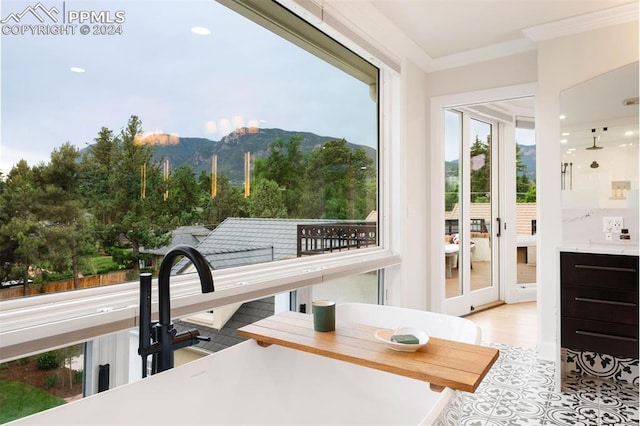 sunroom with a mountain view