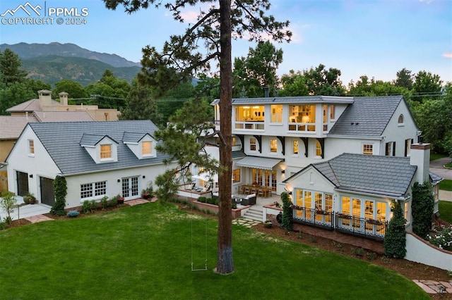 rear view of house with a mountain view and french doors