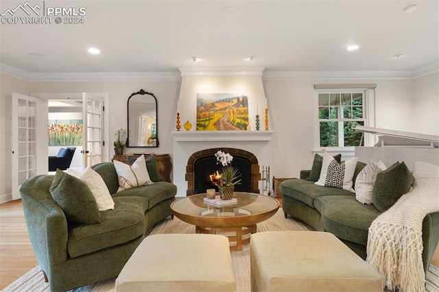 dining space with light hardwood / wood-style flooring and crown molding