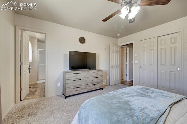 bedroom featuring a closet, ceiling fan, and light carpet