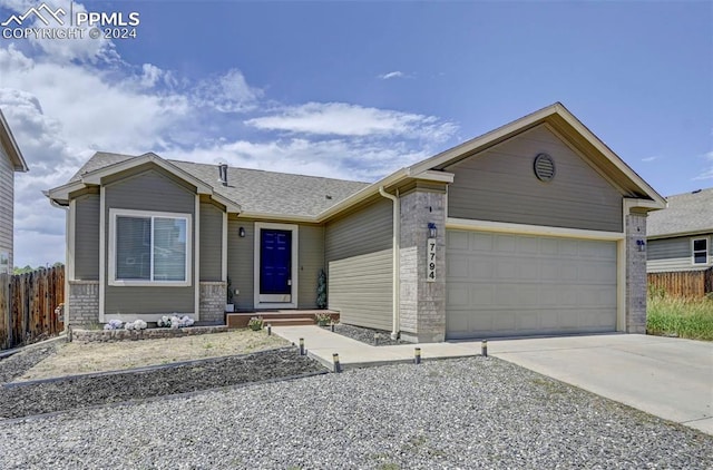 ranch-style home featuring a garage