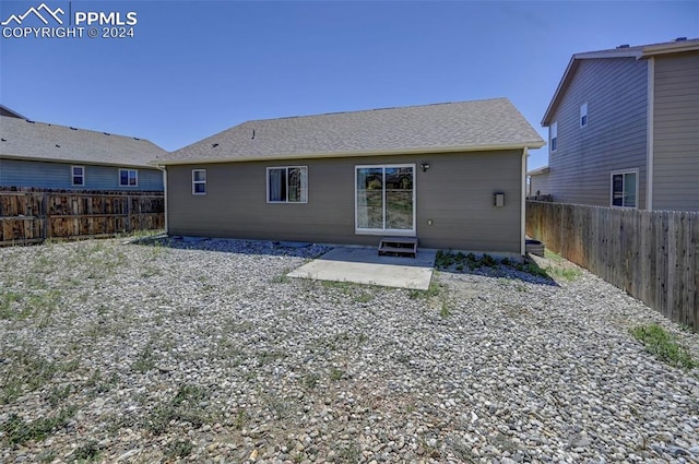 rear view of property featuring a patio