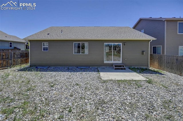 rear view of house with a patio