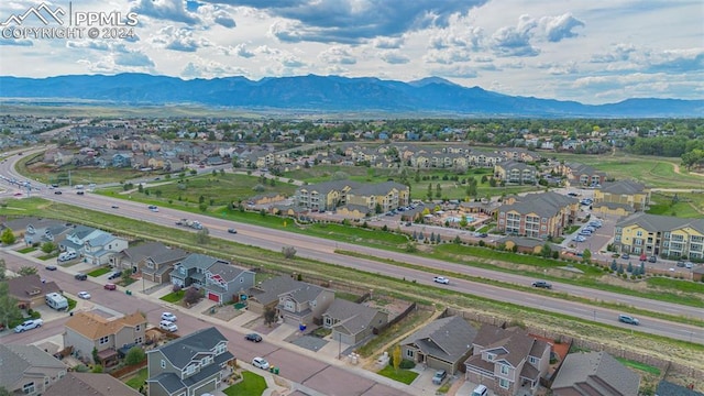 birds eye view of property with a mountain view