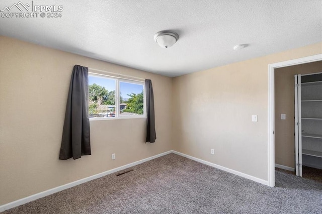 unfurnished bedroom with carpet flooring